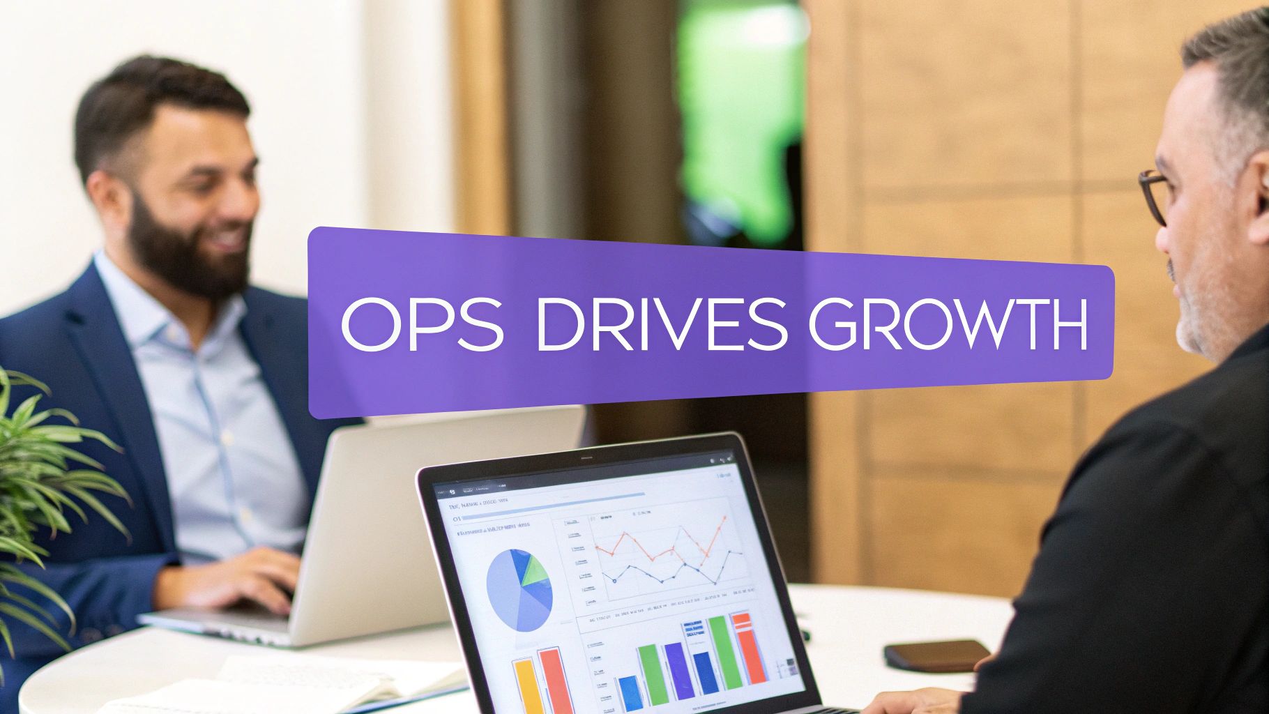 Two men in an office reviewing data on laptops, with a banner stating 'OPS DRIVES GROWTH'.